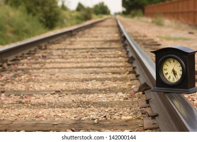 A Clock On A Railroad Track Getting The Time Right Back On Track