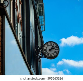 Clock on side of building