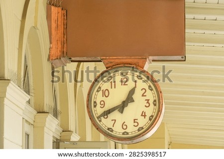 clock on the wall of the old building, closeup of photo