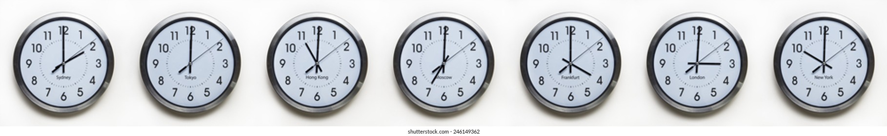 clock on the wall of time zones for trading around the world set at 3PM london GMT time