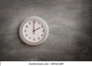 Clock Showing Two O Clock On Gray Wall