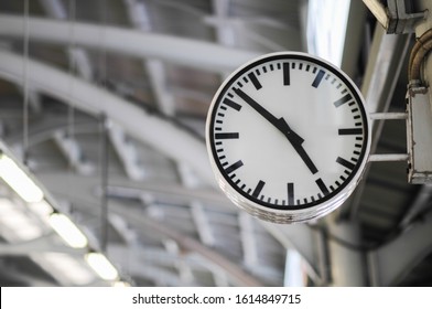 The clock shows the time on the skytrain station