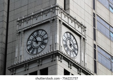 clock at a skyscraper facade