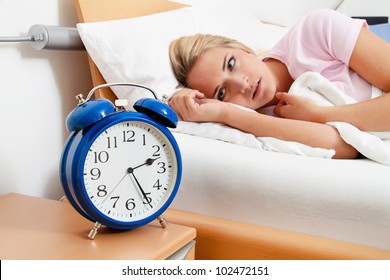 Clock With Sleep At Night. Woman Can Not Sleep.