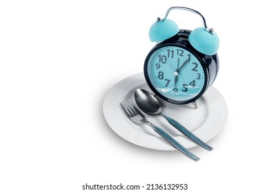 Clock With Spoon And Fork On The Plate. Fasting Concept 