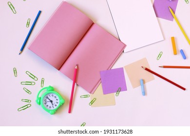 Clock, Stationery, Blank Notepads On The Table, Top View 