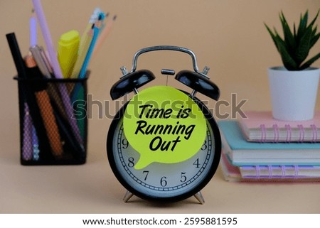 a clock with the text Time is Running Out on a brown background. Suitable for urgency, deadlines, and time management themes.