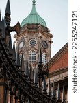 Clock tower behind metal gate, Dublin, Ireland.