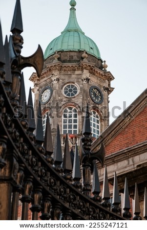 Clock tower behind metal gate, Dublin, Ireland.