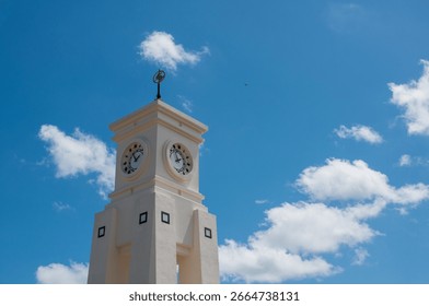 Clock tower with blue sky and clouds