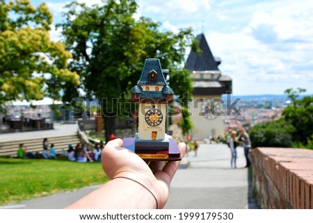 Clock tower and the castle hill in Graz, Austria 