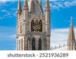 Clock tower of the Cloth Hall of Ypres, Belgium, against the sky.