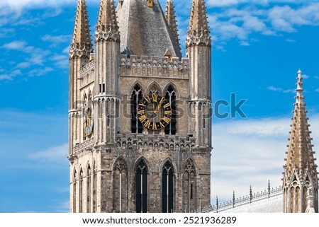 Clock tower of the Cloth Hall of Ypres, Belgium, against the sky.