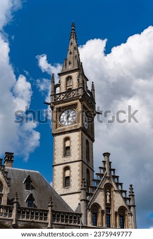 Clock tower of De Post shopping centre and luxury hotel 1898 The Post at Ghent, Belgium
