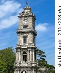 clock tower, famous historical clock tower of Dolmabahce Palace in Istanbul, Turkey from Ottoman Empire. Landmark of Istanbul, Turkey in Palace known as Dolmabahce sarayi saat kulesi in Turkish