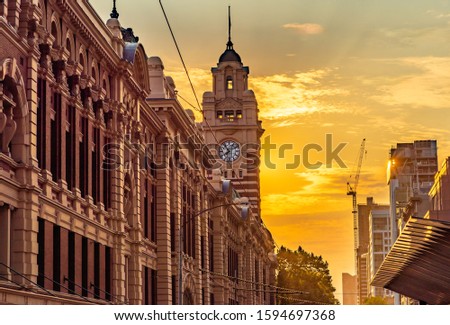 The clock tower of the Flinders Street Train Station in the city of Melbourne, Australia in the late afternoon sun