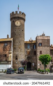 Clock Tower At The Gate, Entering The Old Town Of Bagnaia, In Tuscia