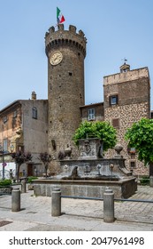 Clock Tower At The Gate, Entering The Old Town Of Bagnaia, In Tuscia