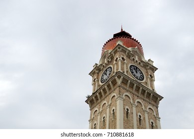 Clock tower over cloudy sky