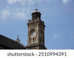 clock tower of small church in English town. religious building exterior. chapel tower 