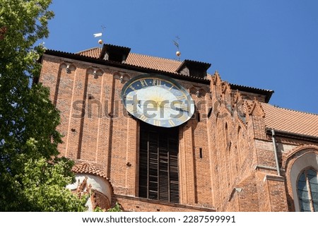Clock tower of St. Johns Cathedral (Katedra pw. sw. Jana Chrzciciela i Jana Ewangelisty) in Torun city in Poland