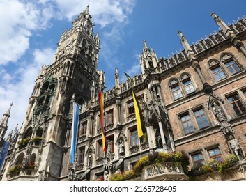 Clock Tower Of The Town Hall Of Munich In Germany And The Flags On Of Symbols Of Oktoberfest