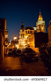The clock tower is visible at the end of the streets of the old town of Batumi. Night photo with beautiful lighting. Adjara, Georgia