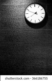 clock wall on black wall