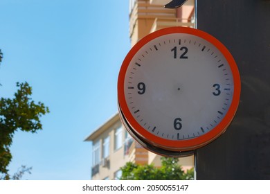 A Clock Without Clock Hands In The Street. Timeless Concept. Public Clock Mockup In The Street. 