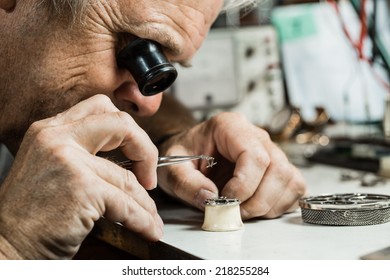 Clockmaker Repairing Wrist Watch.