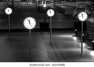 Clocks Of Canary Wharf By Night, London, UK