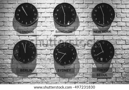 Clocks shows different time zones. Business office concept. Loft interior wallpaper. Vintage effect. 