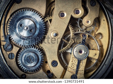 Clockwork old mechanical watch, high resolution and detail. Macro shot. Vintage clockwork background.