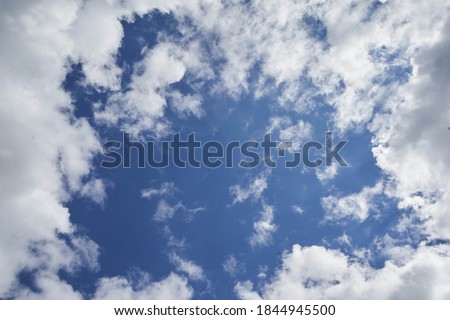 A clody sky, cloud framed around clear sky