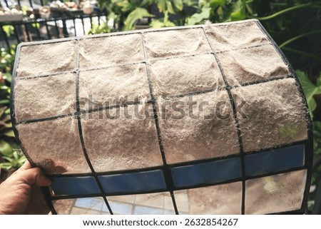 Clogged Air Filter Captured in Macro Showing Dust and Contaminants That Lower Indoor Air Quality and Affect Respiratory Health