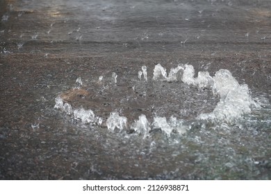 Clogged Road Gully, Drain Clogged Sewer Blocking Storm Water Runoff, Rain So Heavy That Water Flows Up From Drain.