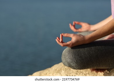 Clos Eup Of A Yogi Hands Doing Yoga Exercise In A Lake