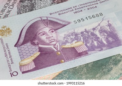 Close up to 10 Gourde or Gourdes of the Republic of Haiti. Paper banknotes of the Caribbean country. Detailed capture of the front art design. Detailed money background wallpaper. Currency bank note