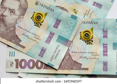 Close Up 1000 Ukrainian Money Hryvnia On White Background. Business Flat Lay With Copy Space For Text. Crisis And Problem Of Financial Turbulence, Inflation, Devalvation, Economics Depression.