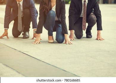 Close Up Of 20-30 Year Old BUSINESS Man And Women Ready To Run At Start Point. Business PEOPLE Wearing A Suit, People Running Race. Who Are Ready And Better Are Winners , Business And Competition 