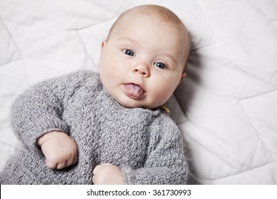 Close Up Of A 3 Month Old Baby Sticking Her Tongue Out