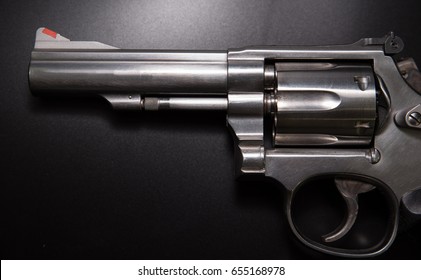 Close Up .38 Caliber Revolver Pistol  In Black Background