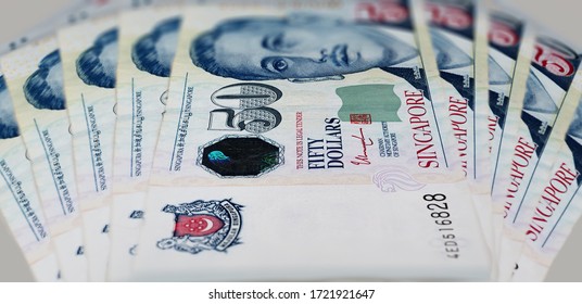 Close Up Of 50 Singapore Dollar. Currency Of The City-state Of Singapore. Bunch Of Fifty Singaporean Dollars. Paper Money With The Portrait Of President Encik Yusof Bin Ishak On The Front Of The Note