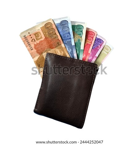 A close up 5000, 1000, 5000, 100, 50, 10 Pak Rupee in a men's leather wallet presents, financial economy, a concept, global economic crisis.
