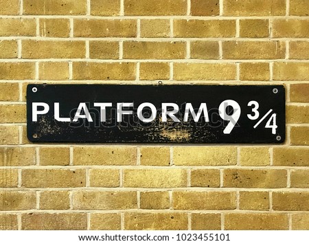 Close up of a 9 3/4 sign at Kings Cross Station.