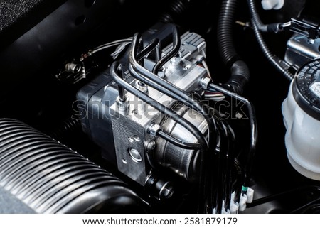 Close up of ABS module in engine bay , Anti lock brake system module of car brake system , automotive parts concept