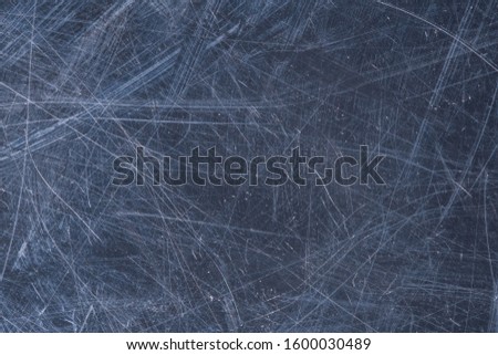 A close up abstract macro photo of a scratches and scraped grungey surface