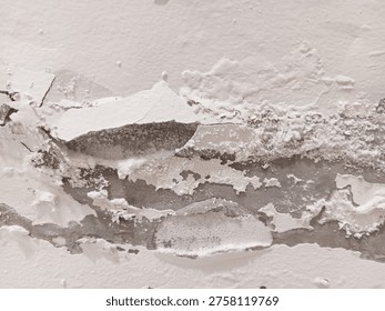 Close up abstract texture of severe damage peeling paint and plaster, bubbling, efflorescence on white wall.