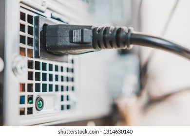 Close Up Of AC Power Cable Plugged Into The Back Of Desktop PC Power Supply