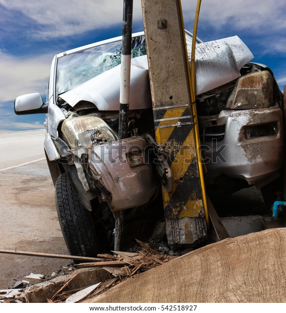 Close accident in\
front of the car collided with a power pole so severe crash\
shattered the sky as a\
backdrop.